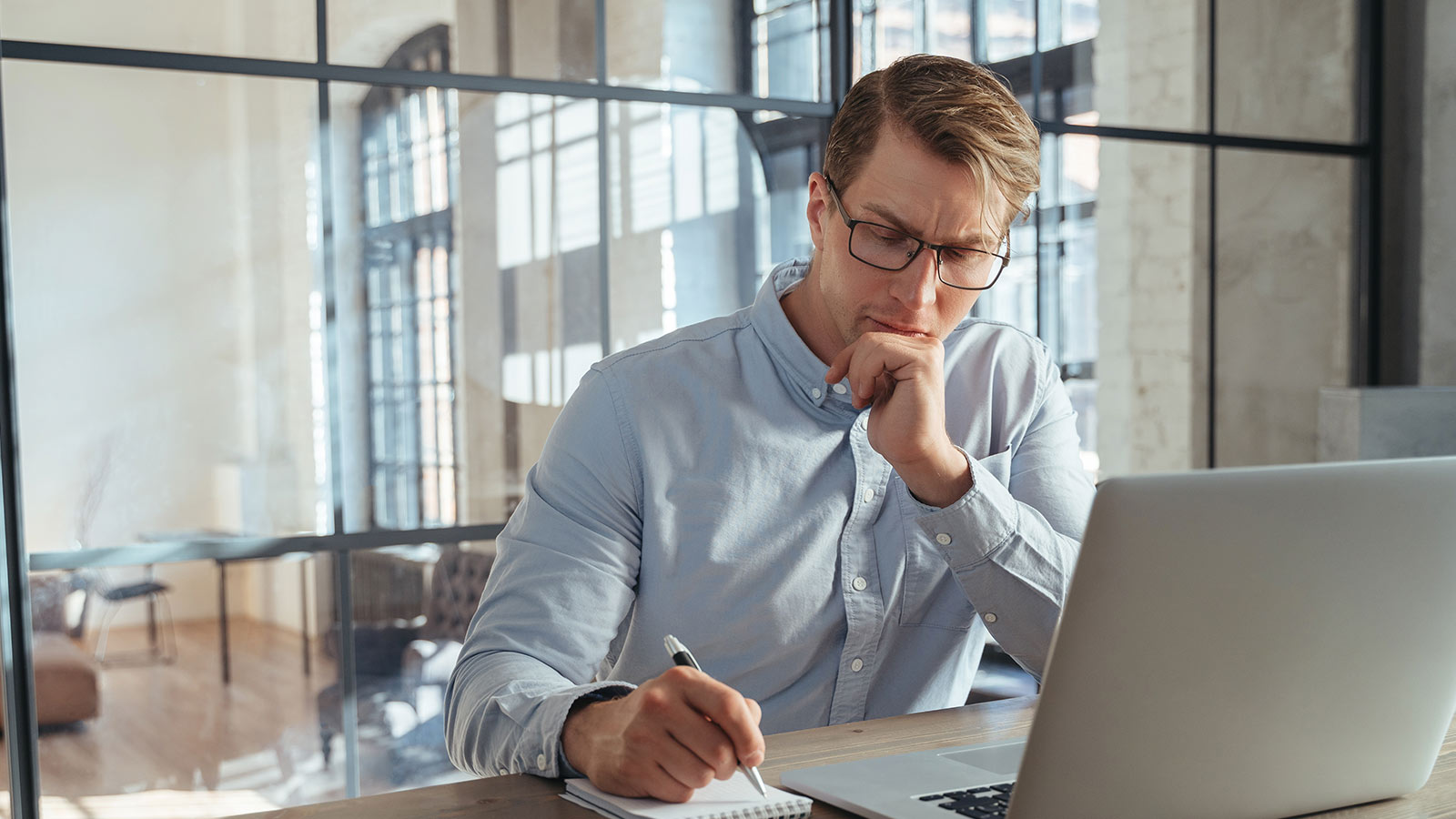 businessman at office in front of laptop making n 2023 04 18 18 01 56 utc