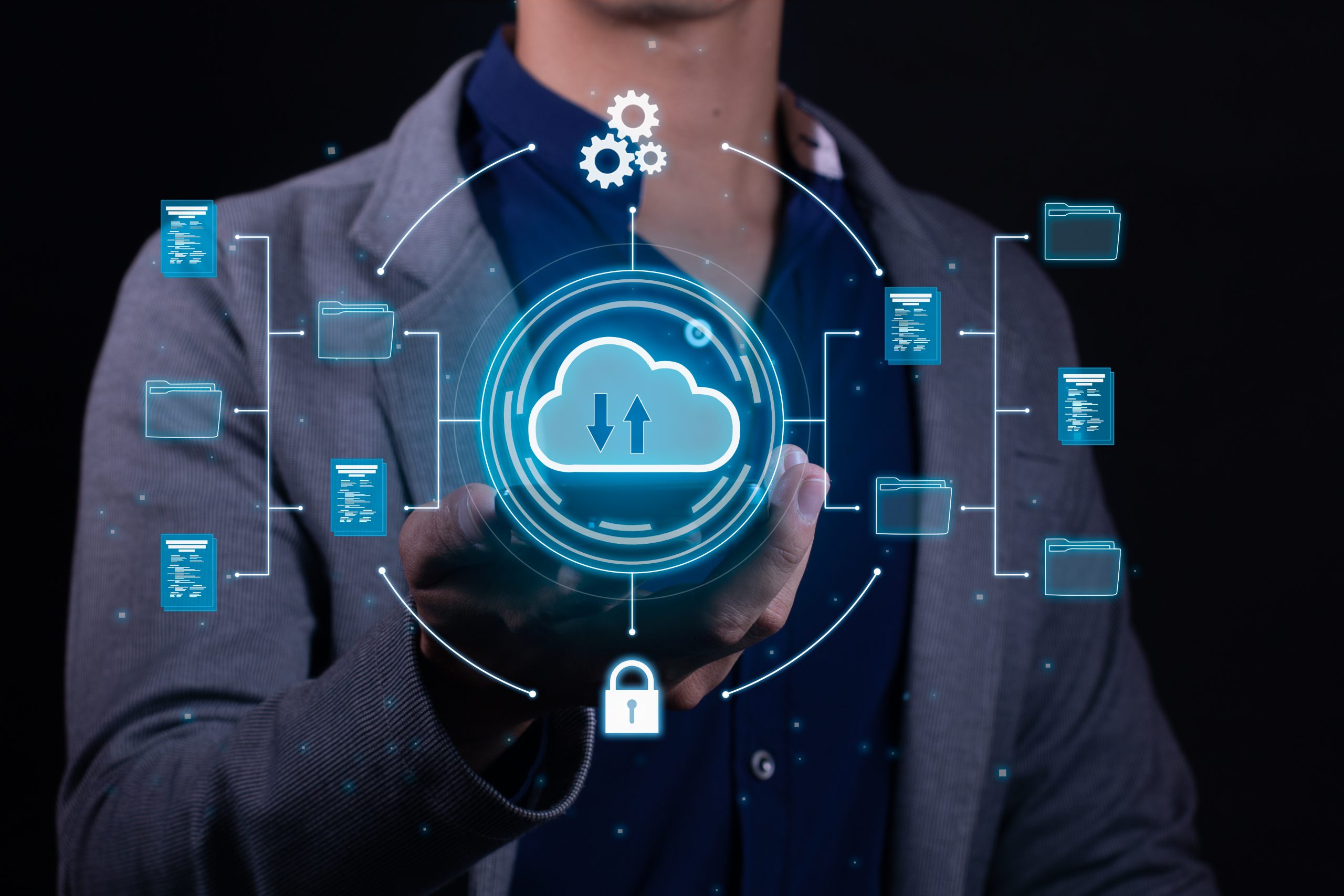 A man employs cloud based computing on his smartphone to facilitate data transmission, storage, backup, and access